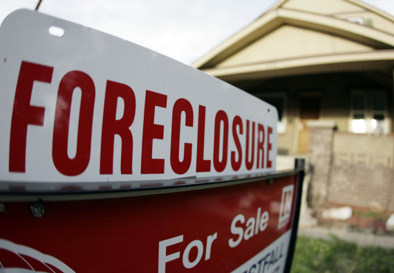 Foreclosure sign in front of a house